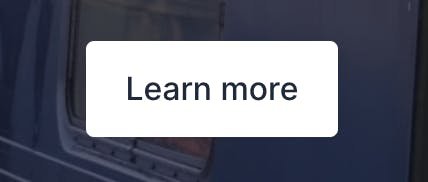 A screenshot of a white, rectangular button that says, 